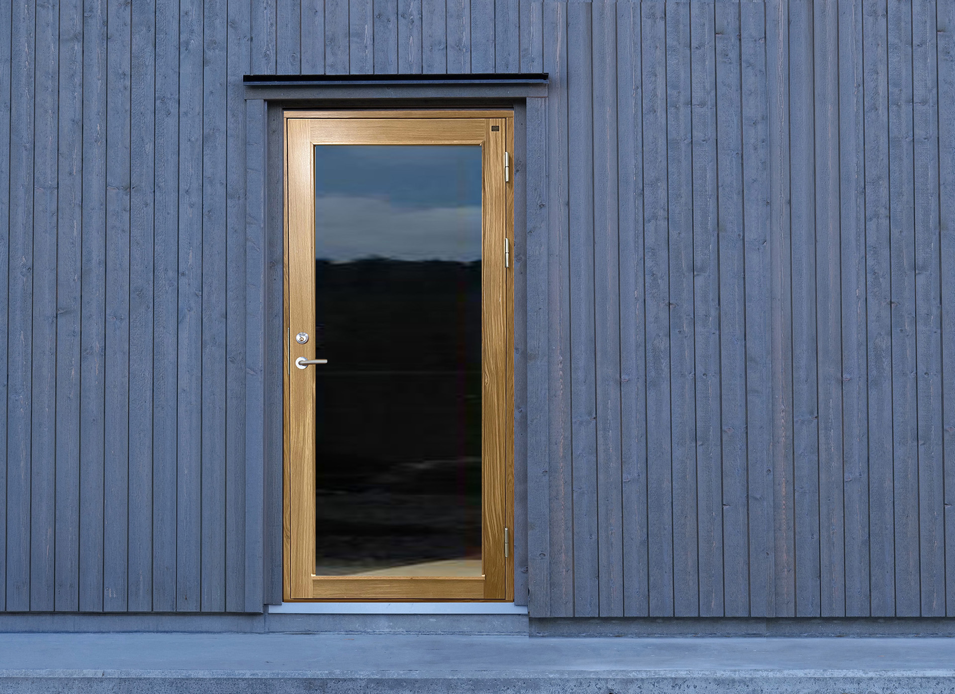 Glasdörr i ek till arkitektritat ladhus